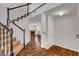 Foyer with staircase leading to an open floor plan and a view of a fireplace at 8236 Bermuda Beach Dr, Las Vegas, NV 89128