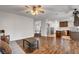 Open-concept space with hardwood floors and a partial view of the kitchen at 8236 Bermuda Beach Dr, Las Vegas, NV 89128