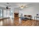 Comfortable living room featuring hardwood floors, a fireplace, and access to the outdoor patio at 8236 Bermuda Beach Dr, Las Vegas, NV 89128