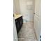 Cozy half bath with a single vanity, neutral color scheme, and tiled floor at 8928 Hand Painted Ct, Las Vegas, NV 89149
