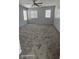 Spacious bedroom featuring soft carpeting, recessed lights, and natural light from large windows at 8928 Hand Painted Ct, Las Vegas, NV 89149