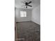 Bedroom with plush carpeting, ceiling fan, and natural light from the windows at 8928 Hand Painted Ct, Las Vegas, NV 89149