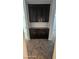 Nice storage featuring dark stained cabinets and dark countertops at 8928 Hand Painted Ct, Las Vegas, NV 89149