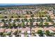 Aerial view of a residential community surrounded by lush greenery and a golf course at 8929 Marble Dr, Las Vegas, NV 89134