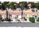 An aerial view of residential neighborhood homes featuring well-kept landscaping and red tile roofs at 8929 Marble Dr, Las Vegas, NV 89134