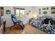 Comfortable bedroom with a large window and hardwood flooring at 8929 Marble Dr, Las Vegas, NV 89134