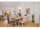 Open-concept dining area with views into the living room with natural light at 8929 Marble Dr, Las Vegas, NV 89134