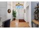 Bright entryway with hardwood floors, decorative rug, and a beautiful front door with a window at 8929 Marble Dr, Las Vegas, NV 89134