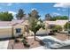 Beautiful home features desert landscaping, mature trees and a well-manicured lawn at 8929 Marble Dr, Las Vegas, NV 89134