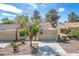 Lovely desert home boasts mature landscaping, mature trees, and a well-manicured lawn at 8929 Marble Dr, Las Vegas, NV 89134
