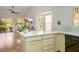 Bright eat-in kitchen featuring white countertops and cabinets, with an adjacent living area at 8929 Marble Dr, Las Vegas, NV 89134