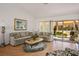 Bright living room with a sliding glass door, plush sofas, and a cozy rug at 8929 Marble Dr, Las Vegas, NV 89134
