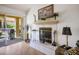 Stylish living area with a tile fireplace, sliding glass doors to the outside, and elegant decor at 8929 Marble Dr, Las Vegas, NV 89134