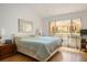 Cozy main bedroom with a large window and hardwood flooring at 8929 Marble Dr, Las Vegas, NV 89134