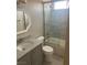 Modern bathroom with gray vanity and a shower over tub at 9232 Marlia St, Las Vegas, NV 89123