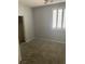Cozy bedroom featuring neutral paint, carpet flooring, and plantation shutters at 9232 Marlia St, Las Vegas, NV 89123