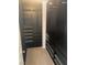 Walk-in closet with custom shelving and drawer organization in dark wood finish and neutral carpet at 9232 Marlia St, Las Vegas, NV 89123