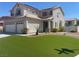 Gorgeous home featuring a well-manicured front yard with desert landscaping and a 3-car garage at 9232 Marlia St, Las Vegas, NV 89123