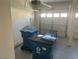 A functional garage space featuring an automatic door, painted floor, and storage options at 9232 Marlia St, Las Vegas, NV 89123