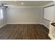 Spacious living room featuring wood flooring, crown molding, and projector screen at 9232 Marlia St, Las Vegas, NV 89123