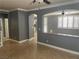 Spacious living room with tile flooring, neutral paint, and an arched room partition at 9232 Marlia St, Las Vegas, NV 89123