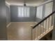 Spacious living room featuring tile floors, neutral paint, and plantation shutters at 9232 Marlia St, Las Vegas, NV 89123