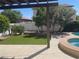 A private pool and spa area with lush landscaping and a seating area at 9232 Marlia St, Las Vegas, NV 89123
