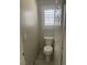 Small powder room with tiled flooring and a window with shutters at 9232 Marlia St, Las Vegas, NV 89123