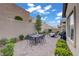 Backyard featuring a brick patio, lush landscaping, a built-in BBQ, and plenty of seating at 961 Cutter St, Henderson, NV 89011