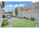 Serene backyard featuring lush green turf, manicured landscaping, and a charming patio set at 961 Cutter St, Henderson, NV 89011