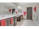 Bright bathroom with dual sinks, large mirror, walk-in shower, and tile flooring at 961 Cutter St, Henderson, NV 89011