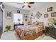 Cozy bedroom featuring a ceiling fan, carpet floors, a window, and tasteful decor at 961 Cutter St, Henderson, NV 89011