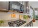 Close-up of a kitchen countertop with stainless steel appliances and granite counters at 961 Cutter St, Henderson, NV 89011