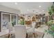 View of kitchen that opens to the dining area, complete with sliding glass doors to patio at 961 Cutter St, Henderson, NV 89011