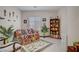 Cozy sitting room with ample natural light, comfortable seating, and a decorative bookshelf, perfect for relaxation at 961 Cutter St, Henderson, NV 89011