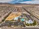 Community aerial view showing large recreational park with play areas, pool and spacious parking at 9655 Shadow Cliff Ave, Las Vegas, NV 89166