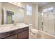 Bathroom featuring single vanity sink, tiled floors and glass shower at 9655 Shadow Cliff Ave, Las Vegas, NV 89166