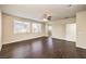 Bedroom featuring dark floors, ceiling fan and a door leading to bathroom at 9655 Shadow Cliff Ave, Las Vegas, NV 89166