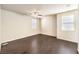 Spacious bedroom featuring a ceiling fan and two windows for plenty of natural light at 9655 Shadow Cliff Ave, Las Vegas, NV 89166