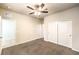 Bedroom features carpet floors, a ceiling fan, and closet doors at 9655 Shadow Cliff Ave, Las Vegas, NV 89166