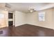 View of bedroom with dark cabinets and entry to bathroom with tiled floor at 9655 Shadow Cliff Ave, Las Vegas, NV 89166