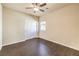 Bedroom with a window, hardwood floors and a closet with bi-fold doors at 9655 Shadow Cliff Ave, Las Vegas, NV 89166