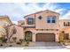 Two-story home features charming desert landscaping, two car garage, and covered entry at 9655 Shadow Cliff Ave, Las Vegas, NV 89166