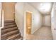Hallway showing staircase with carpet and tile floor leading to a bathroom at 9655 Shadow Cliff Ave, Las Vegas, NV 89166