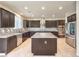 Modern kitchen with granite countertops, stainless steel appliances, and a central island at 9655 Shadow Cliff Ave, Las Vegas, NV 89166
