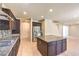 Updated kitchen with stainless steel appliances, granite countertops, and a center island at 9655 Shadow Cliff Ave, Las Vegas, NV 89166