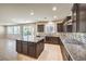 Spacious kitchen featuring a large island, stainless appliances, and ample counter space at 9655 Shadow Cliff Ave, Las Vegas, NV 89166