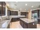 Well-lit kitchen with a large island, granite counters, and stainless steel appliances at 9655 Shadow Cliff Ave, Las Vegas, NV 89166