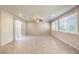 Spacious living room with tile floors and large window at 9655 Shadow Cliff Ave, Las Vegas, NV 89166
