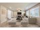 Open living room with large window, ceiling fan, and contemporary furniture at 9655 Shadow Cliff Ave, Las Vegas, NV 89166